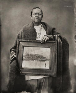 Taos Pueblo Artist With Painting
