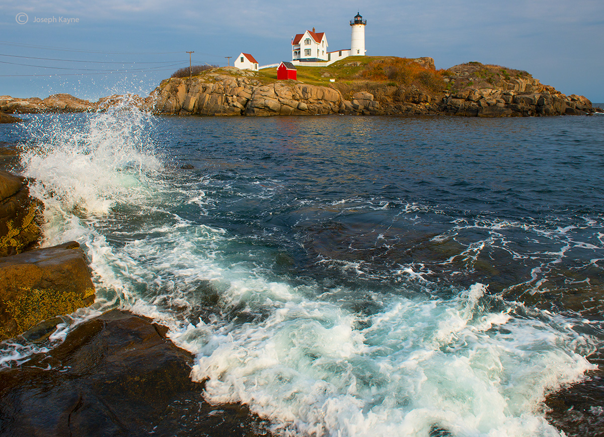 A Wave Crashes By Nubble Lighthouse