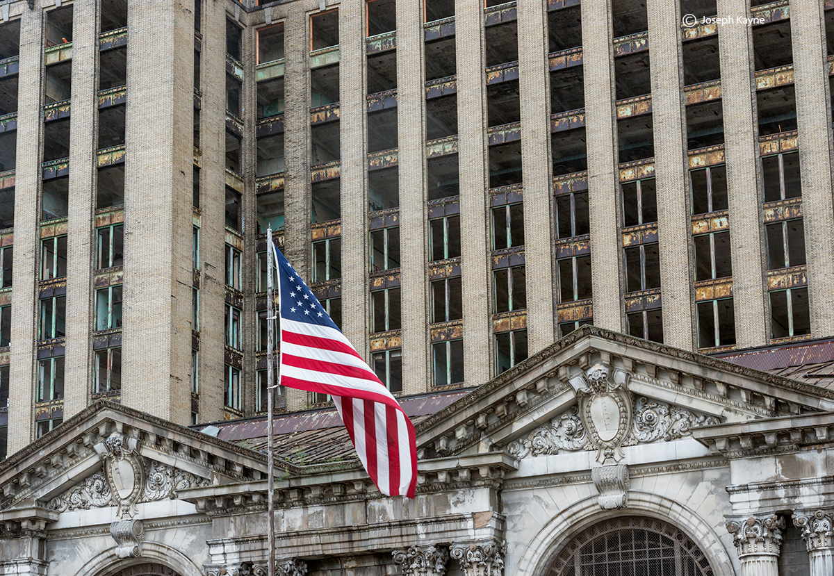 American Flag Displayed By An Abandoned Building