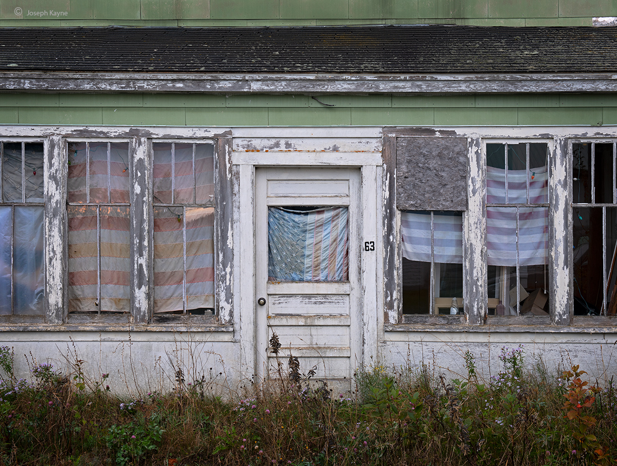 Old House & Faded Flags