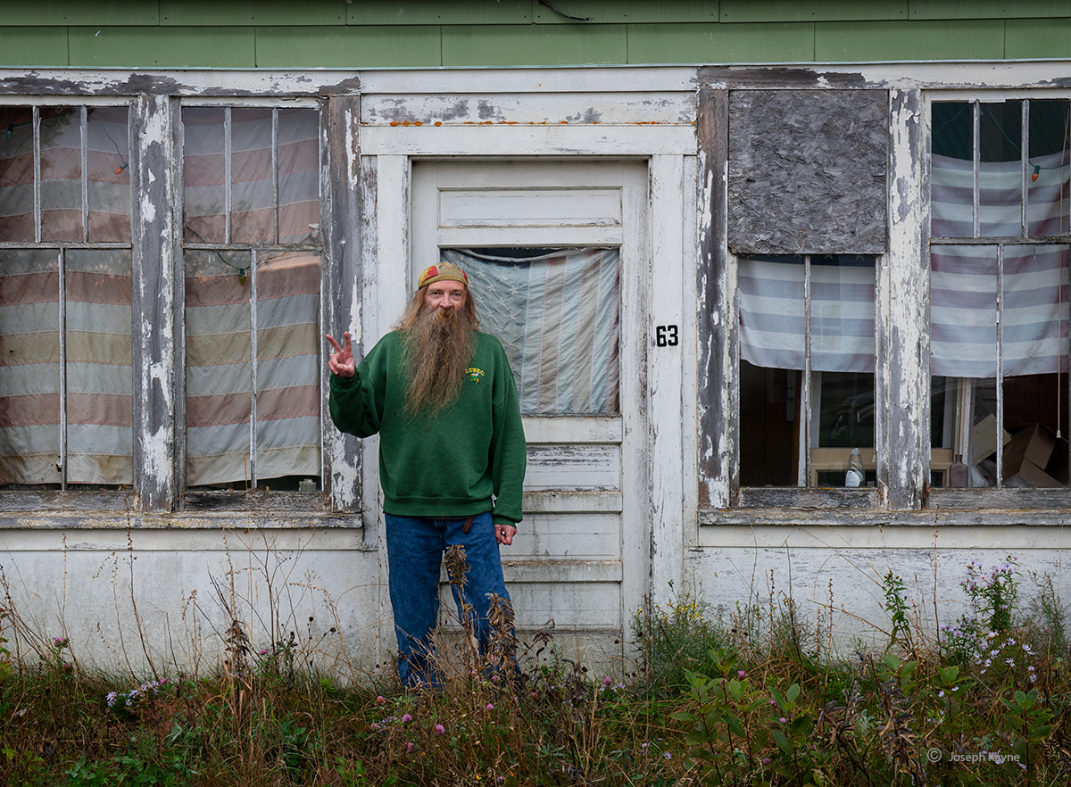 Dale in front of his house